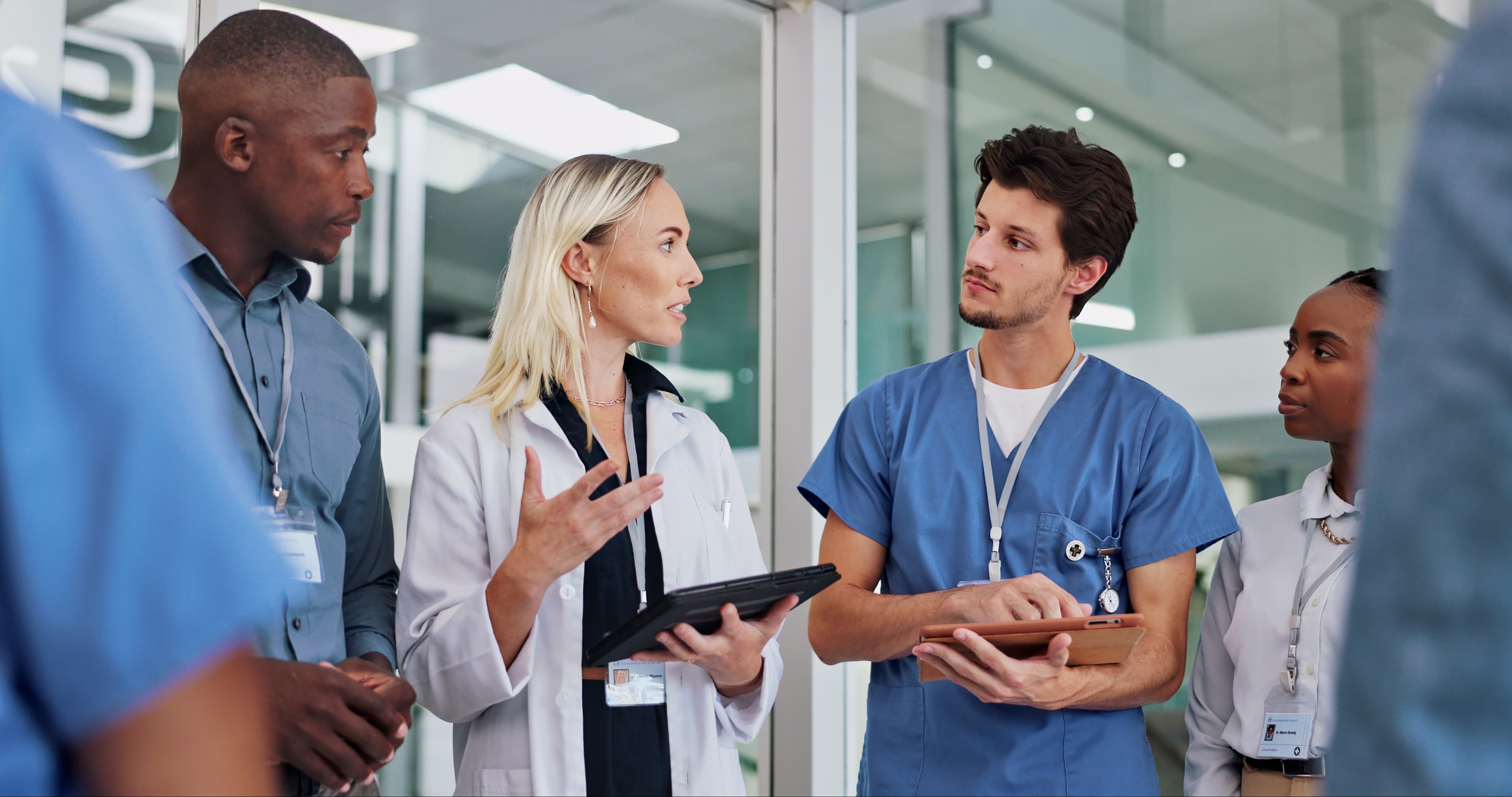 Clinicians reviewing results on a tablet